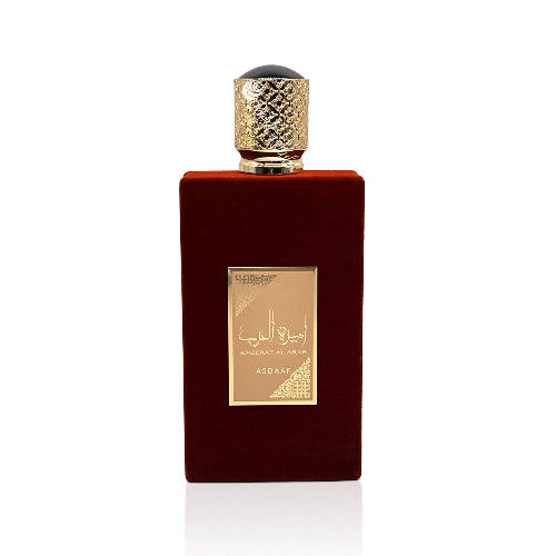 Perfume Lattafa Ameerat Al Arab 100ml frasco revestido en terciopelo rojo con detalles plateados esencia de uva flores blancas y almizcle en Musk Dor.